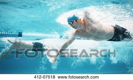 Swimmers racing in pool View Large Photo Image Stock Photo - Swimmers racing in pool. Fotosearch