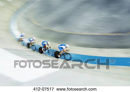 Track cycling team racing in velodrome View Large Photo Image Stock Photo - Track cycling team racing in velodrome. Fotosearch