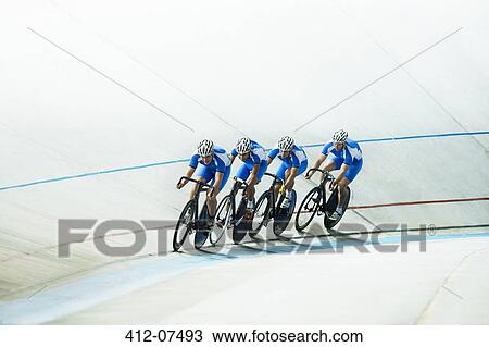 Track cyclists riding in velodrome View Large Photo Image Stock Image - Track cyclists riding in velodrome. Fotosearch