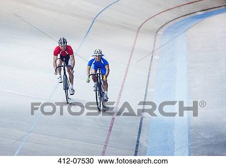 Track cyclists riding in velodrome View Large Photo Image Stock Image - Track cyclists riding in velodrome. Fotosearch