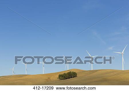 Wind turbines on hilltop View Large Photo Image Stock Photo - Wind turbines on hilltop. Fotosearch