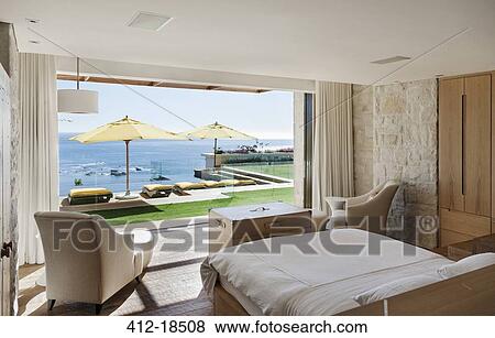Bedroom overlooking patio and ocean View Large Photo Image Stock Photo - Bedroom overlooking patio and ocean. Fotosearch