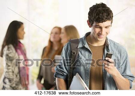 College student text messaging with cell phone View Large Photo Image Stock Photo - College student text messaging with cell phone. Fotosearch