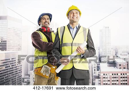 Construction workers in urban window View Large Photo Image Stock Image - Construction workers in urban window. Fotosearch