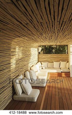 Cushions on sunny wooden patio View Large Photo Image Stock Photo - Cushions on sunny wooden patio. Fotosearch