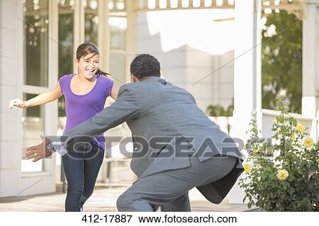 Stock Photo - Daughter running to father. Fotosearch