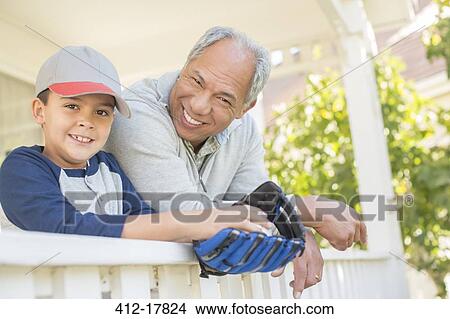 Grandfather and grandson with baseball glove on porch View Large Photo Image Picture - Grandfather and grandson with baseball glove on porch. Fotosearch