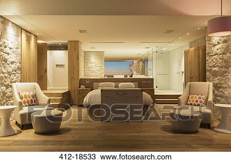Illuminated bedroom open to patio at night View Large Photo Image Stock Image - Illuminated bedroom open to patio at night. Fotosearch