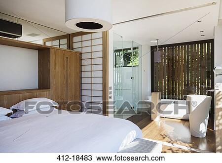 Luxury bedroom and en suite bathroom View Large Photo Image Stock Image - Luxury bedroom and en suite bathroom. Fotosearch