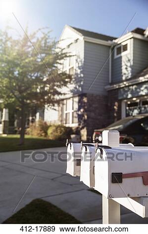 Mailboxes outside house View Large Photo Image Stock Photo - Mailboxes outside house. Fotosearch