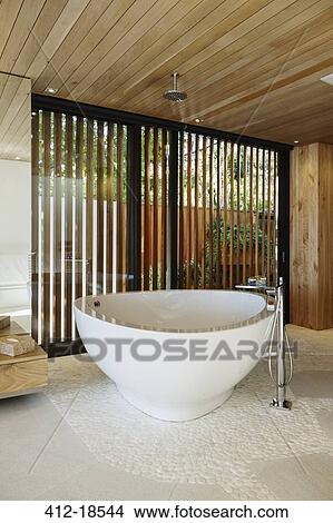 Modern soaking tub in bathroom View Large Photo Image Picture - Modern soaking tub in bathroom. Fotosearch