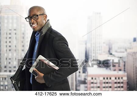 Portrait of businessman in urban window View Large Photo Image Stock Photography - Portrait of businessman in urban window. Fotosearch