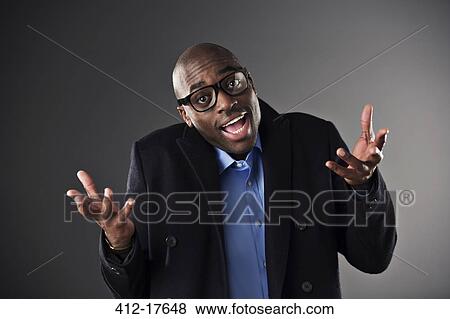 Portrait of businessman shrugging View Large Photo Image Stock Photo - Portrait of businessman shrugging. Fotosearch