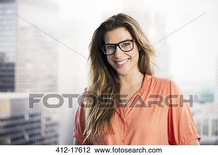 Portrait of confident businesswoman in urban window View Large Photo Image Stock Image - Portrait of confident businesswoman in urban window. Fotosearch
