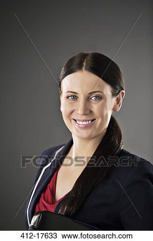 Stock Image - Portrait of confident businesswoman. Fotosearch