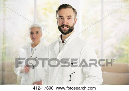 Portrait of confident doctors View Large Photo Image Stock Image - Portrait of confident doctors. Fotosearch