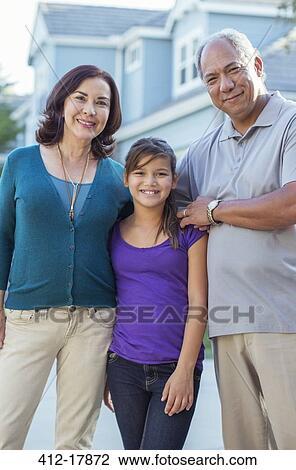 Portrait of grandparents and granddaughter in driveway View Large Photo Image Stock Image - Portrait of grandparents and granddaughter in driveway. Fotosearch
