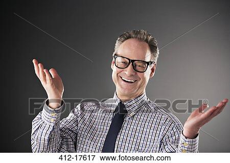 Portrait of happy businessman gesturing View Large Photo Image Stock Photo - Portrait of happy businessman gesturing. Fotosearch