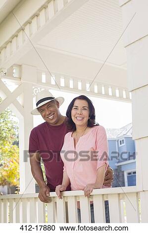 Portrait of happy couple on porch View Large Photo Image Stock Image - Portrait of happy couple on porch. Fotosearch