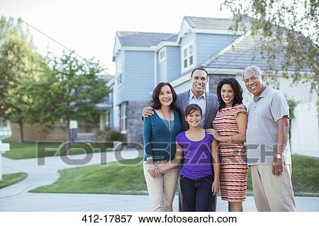 Stock Photo - Portrait of multi-generation family in driveway. Fotosearch