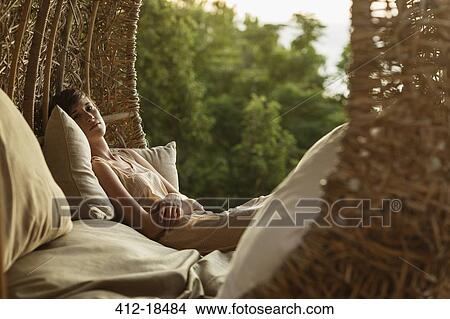 Portrait of serene woman in nest tree house View Large Photo Image Picture - Portrait of serene woman in nest tree house. Fotosearch