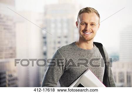 Portrait of smiling businessman in urban window View Large Photo Image Stock Photo - Portrait of smiling businessman in urban window. Fotosearch