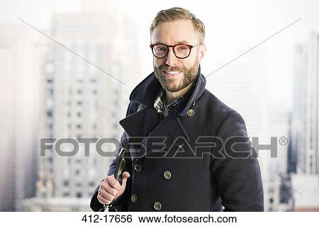Portrait of smiling businessman in urban window View Large Photo Image Stock Photograph - Portrait of smiling businessman in urban window. Fotosearch