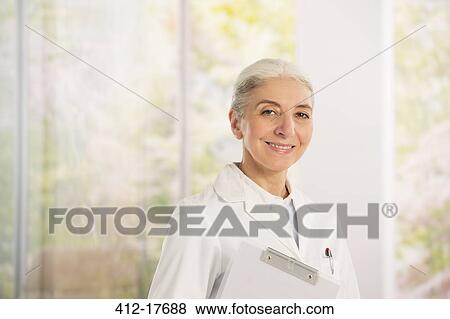 Stock Photo - Portrait of smiling doctor. Fotosearch