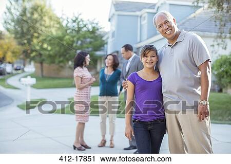 Portrait of smiling grandfather and granddaughter in driveway View Large Photo Image Stock Image - Portrait of smiling grandfather and granddaughter in driveway. Fotosearch