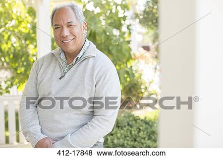 Portrait of smiling man on sunny porch View Large Photo Image Stock Photo - Portrait of smiling man on sunny porch. Fotosearch