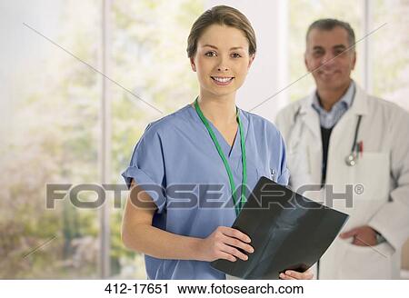 Portrait of smiling nurse with x-ray View Large Photo Image Stock Image - Portrait of smiling nurse with x-ray. Fotosearch