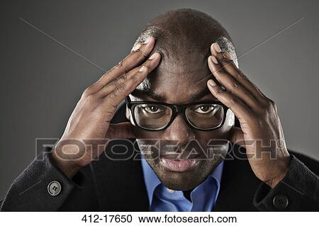 Portrait of stressed businessman with head in hands View Large Photo Image Stock Image - Portrait of stressed businessman with head in hands. Fotosearch