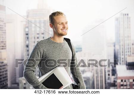 Smiling businessman in urban window View Large Photo Image Stock Photograph - Smiling businessman in urban window. Fotosearch