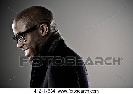 Smiling man in horn rimmed glasses View Large Photo Image Picture - Smiling man in horn rimmed glasses. Fotosearch