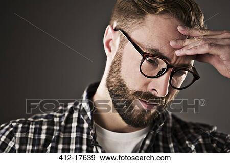 Stressed man with head in hands View Large Photo Image Stock Photo - Stressed man with head in hands. Fotosearch