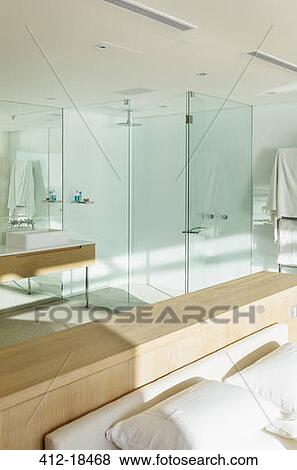 Sun shining in bedroom with en suite bathroom View Large Photo Image Stock Photo - Sun shining in bedroom with en suite bathroom. Fotosearch