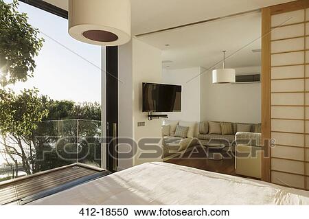 Sunny bedroom with balcony View Large Photo Image Stock Image - Sunny bedroom with balcony. Fotosearch