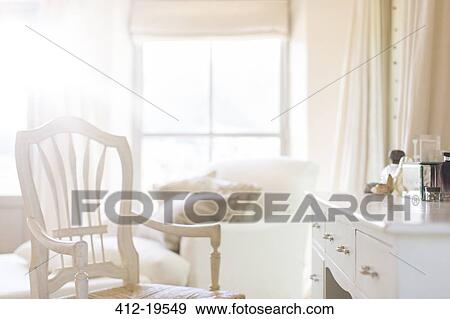 Armchair at vanity of rustic house View Large Photo Image Stock Photo - Armchair at vanity of rustic house. Fotosearch