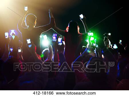 Audience enjoying concert View Large Photo Image Stock Photograph - Audience enjoying concert. Fotosearch