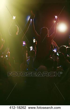 Audience with camera phones at concert View Large Photo Image Stock Image - Audience with camera phones at concert. Fotosearch