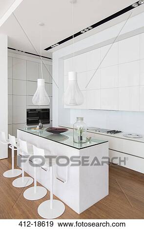 Bar stools at counter in modern kitchen View Large Photo Image Stock Photo - Bar stools at counter in modern kitchen. Fotosearch