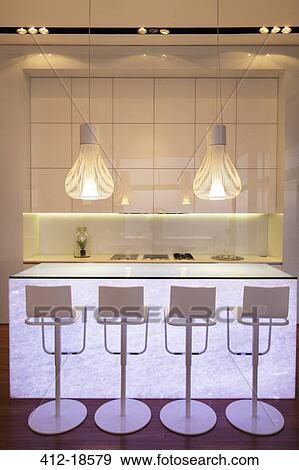 Stock Photo - Bar stools in modern kitchen. Fotosearch