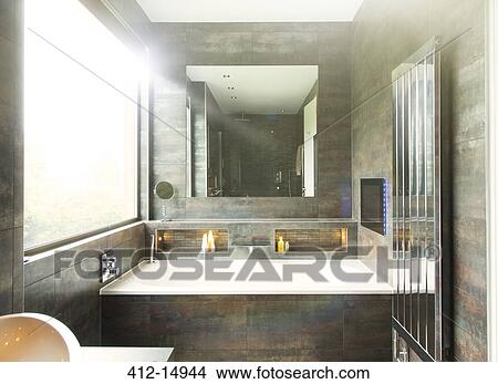 Bathtub and mirror in modern bathroom View Large Photo Image Picture - Bathtub and mirror in modern bathroom. Fotosearch
