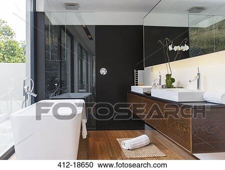 Bathtub and sinks in modern bathroom View Large Photo Image Stock Image - Bathtub and sinks in modern bathroom. Fotosearch