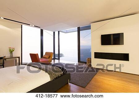Bedroom and glass doors of modern house View Large Photo Image Stock Photo - Bedroom and glass doors of modern house. Fotosearch