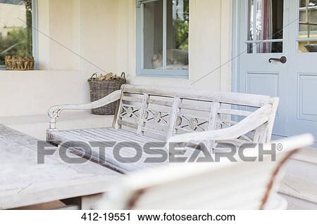 Bench and table in modern backyard View Large Photo Image Stock Image - Bench and table in modern backyard. Fotosearch