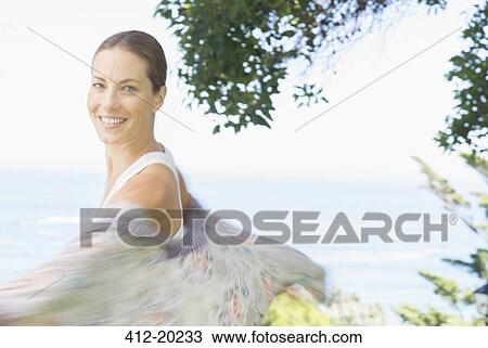 Blurred view of woman spinning outdoors View Large Photo Image Stock Image - Blurred view of woman spinning outdoors. Fotosearch