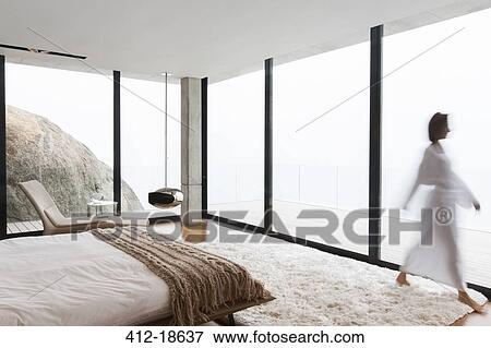 Blurred view of woman wearing bathrobe in bedroom View Large Photo Image Stock Photo - Blurred view of woman wearing bathrobe in bedroom. Fotosearch