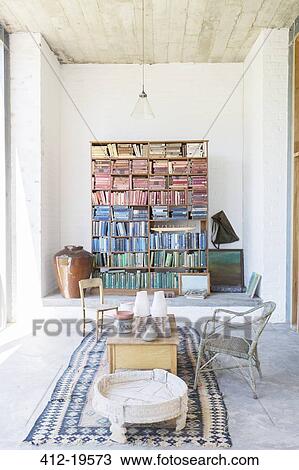 Bookshelves and coffee table in rustic house View Large Photo Image Stock Image - Bookshelves and coffee table in rustic house. Fotosearch