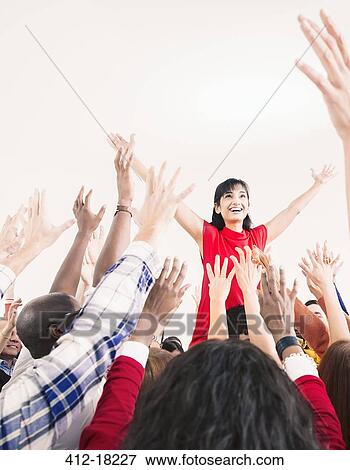 Stock Photo - Business people cheering for businesswoman. Fotosearch